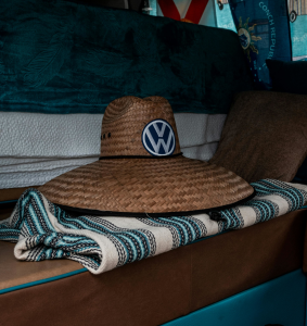 Straw hat with Volkswagen logo on it