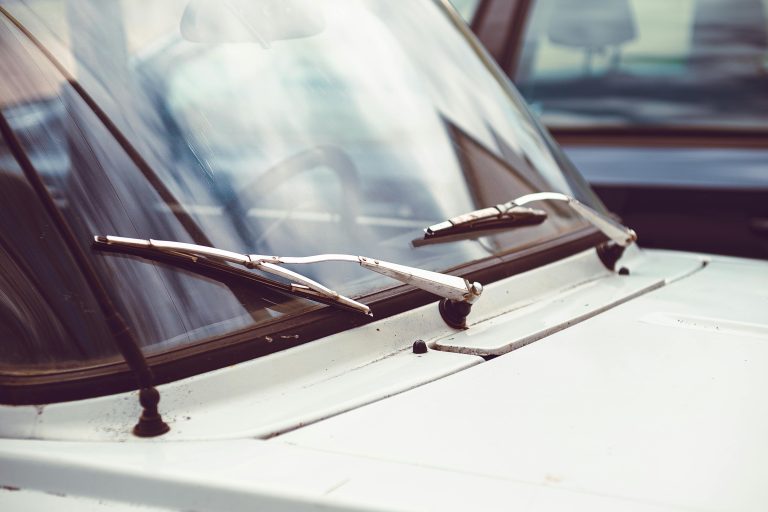 Windshield wipers in default position on car windshield