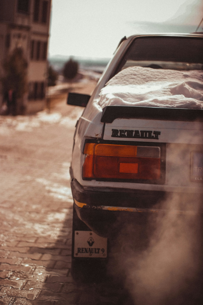 Rear view of car idling in winter